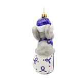 Plush toy elephant with a purple ornament on a white background