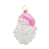 Decorative Christmas ornament shaped like a white figure with a pink hat on a white background