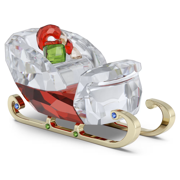 Crystal sleigh with colorful gemstones on a white background